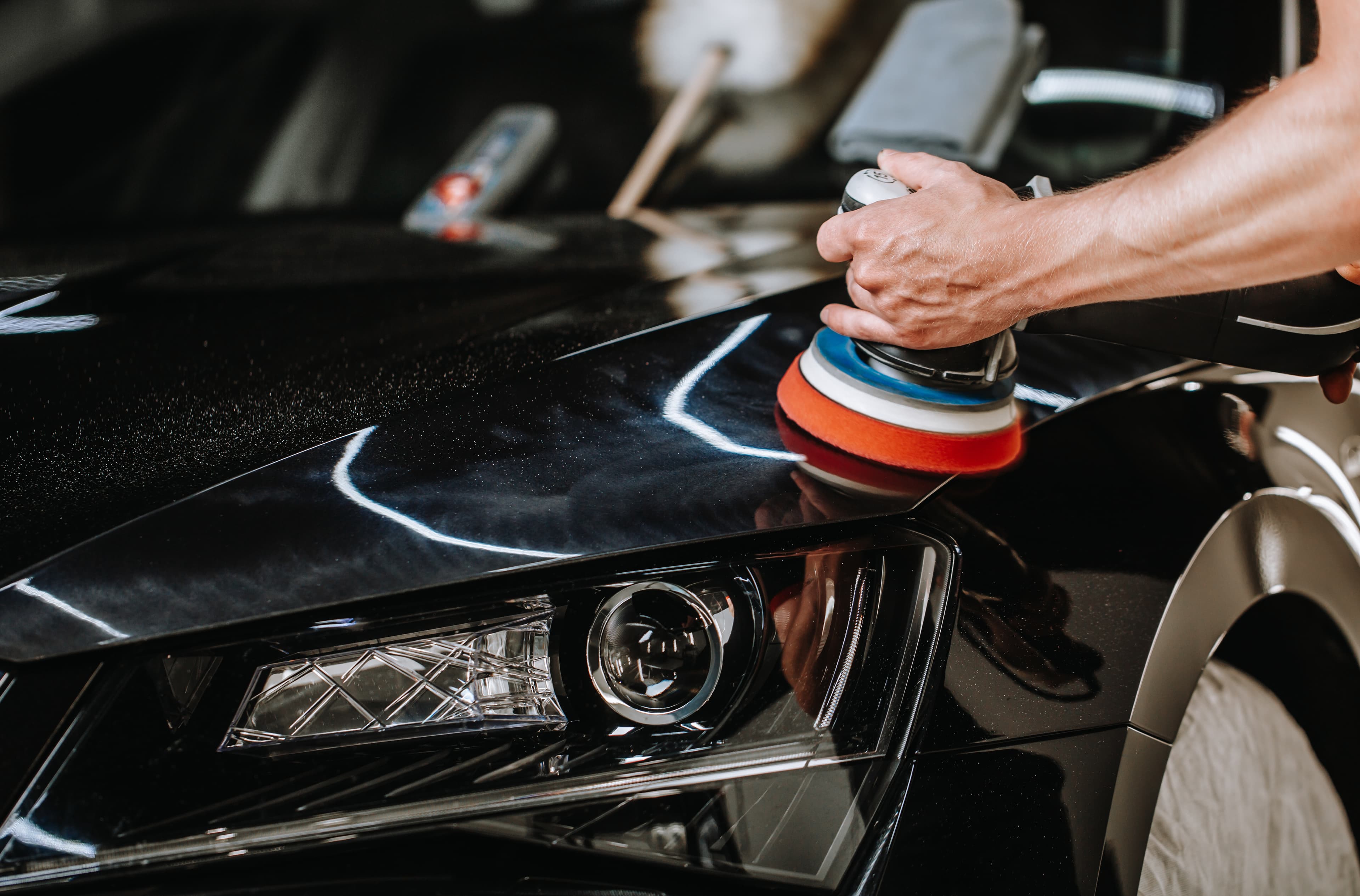 Auto detailer working on a car